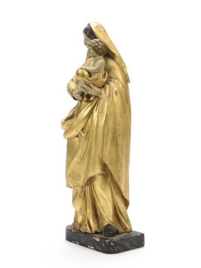 null Vierge à l'Enfant en bois sculpté et doré 
Socle en bois peint
18ème siècle
H:...