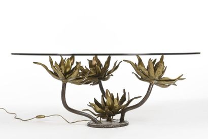 null Paul MOERENHOUT (XX- XXI ème)
Table basse éclairante en bronze à décor de quatre...