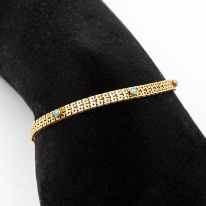 null Bracelet en or jaune (750) 18K rehaussé de turquoises. 

Poids: 6,50 g AIGL...