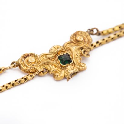 null Bracelet en or jaune 18K (750) à deux rangs maille serpent, coupés d'un motifs...