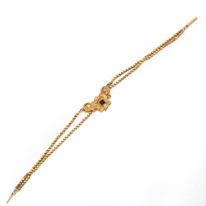 null Bracelet en or jaune 18K (750) à deux rangs maille serpent, coupés d'un motifs...