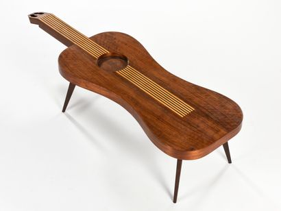 null WORK 1960

Coffee table with a tapered base and a guitar-shaped inlaid wooden...