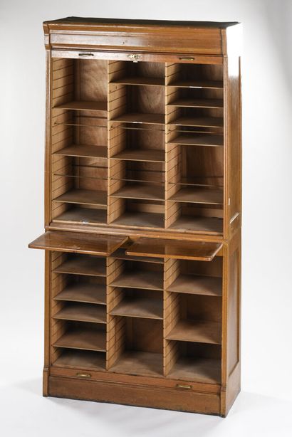 null Light oak curtain cabinet 

In two parts 

The curtain uncovers compartments...