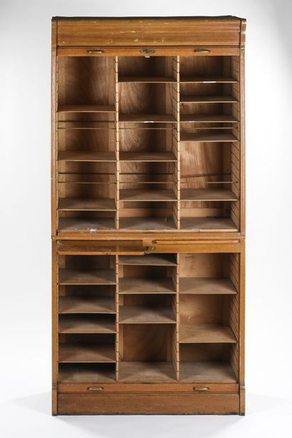 null Light oak curtain cabinet 

In two parts 

The curtain uncovers compartments...