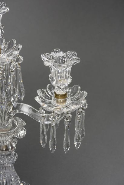null BACCARAT A candelabra in molded and cut crystal with three lights and pendants

H...