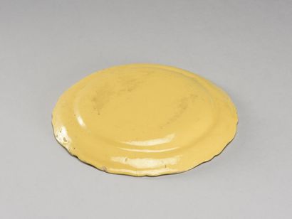 null MOUSTIERS Earthenware plate with scalloped wing decorated with a bouquet of...