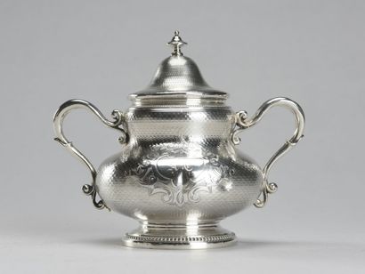 null Tea set in silver guilloche including: a sugar bowl, a coffee pot, a milk jug.

Minerva...