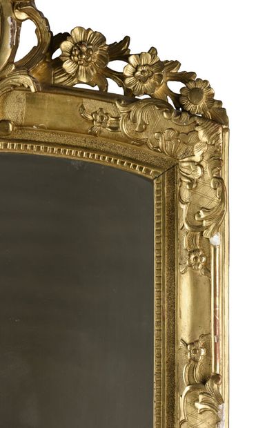 null Wood and gilded stucco mantel mirror decorated with shells and scrolls of flowers...