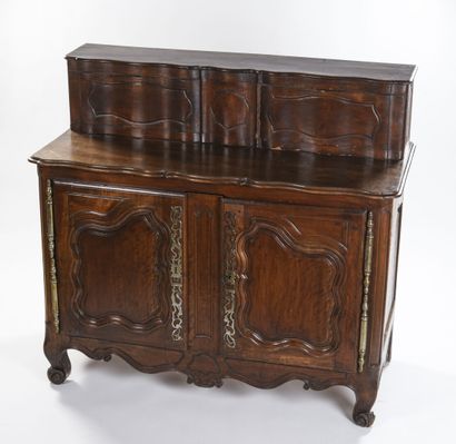 null Walnut sliding sideboard, molded and carved 

Provencal work

End of 18th century

H...