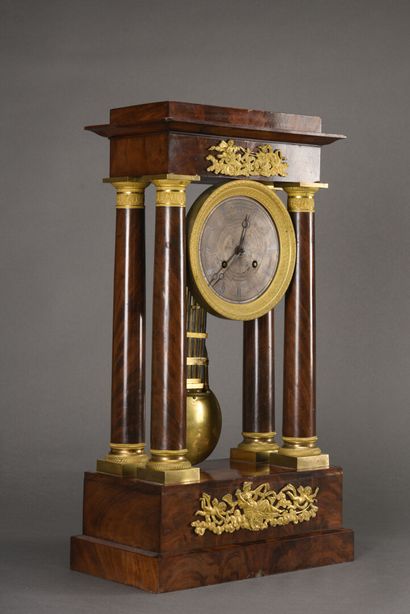 null Portico clock in mahogany, silvered steel dial with Roman numerals, the base...