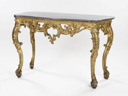 null Gilded wood console carved with large foliage scrolls, openwork crosspiece centered...
