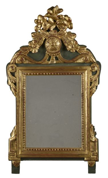 null Gilded wood pediment mirror carved with flowers held by a rose window.

Louis...
