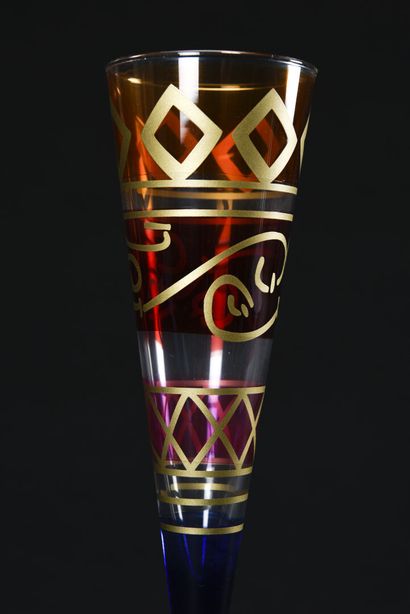 null Suite of eleven colored glass flutes decorated with golden geometric friezes,...