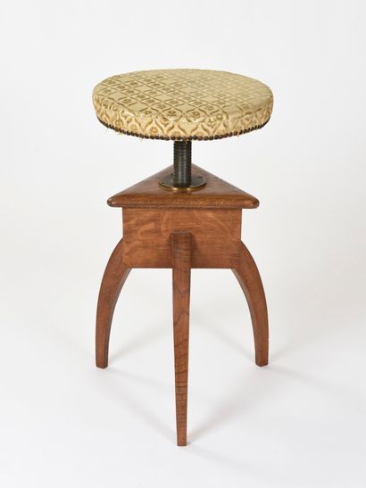  Vincent GONZALEZ (1928-2019) 
Piano stool with three carved wooden legs joined by...