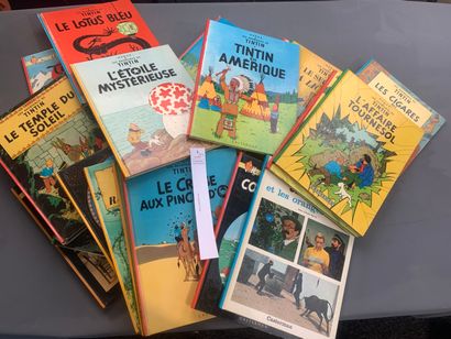 null [Hergé]. Tintin. Un ensemble de 24 albums. Etat d'usage.