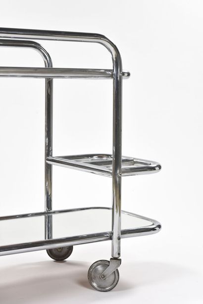 null Modernist work 

Chromed metal tube trolley with two mirrored trays.

Circa...