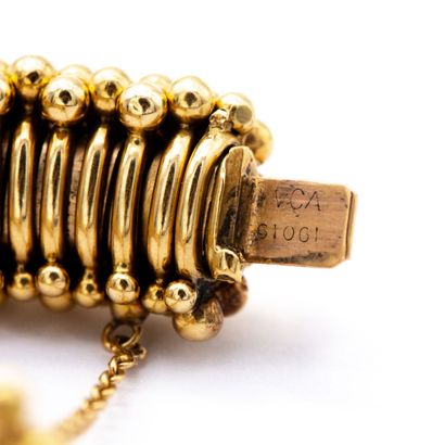 null VCA. Signé. N°61061. Bracelet articulé composé d'un bracelet tubogaz en métal...
