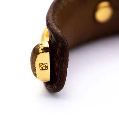 null HERMES signed. Bamboo" bracelet in varan leather, gold-plated metal trim.