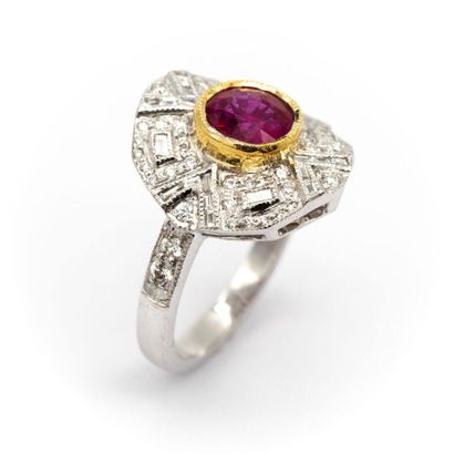 null Ring in 18K white gold, set with a round ruby, on a basket of calibrated diamonds...