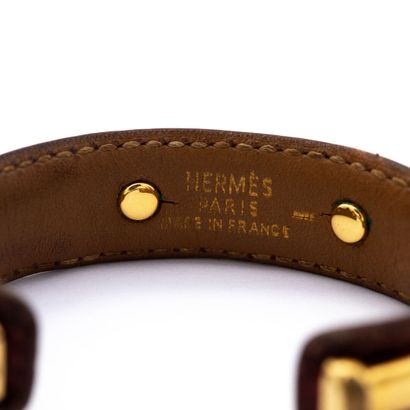 null HERMES signed. Bamboo" bracelet in varan leather, gold-plated metal trim.