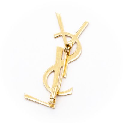 null Broche en or jaune (750) 18K YVES SAINT LAURENT, formant les initiales. 

Poids...