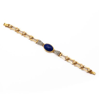 null Bracelet en or jaune 18 K (750) maillons étriers, articulés par une demi perle...