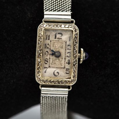null Lady's watch. Rectangular case in 18K white gold (750) set with roses. 

Clasp...