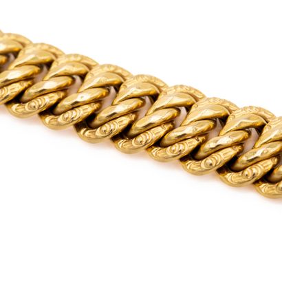 null Flexible bracelet in 18 K (750) yellow gold, American mesh. 

Weight : 29,5...