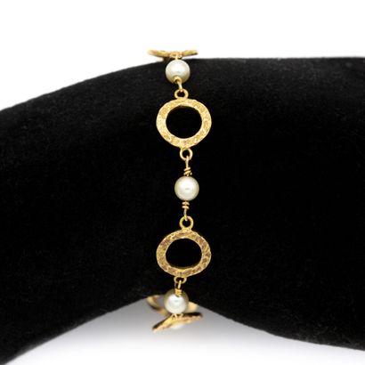 null Bracelet souple en or jaune 18 K (750) anneaux martelés sur une face alternés...