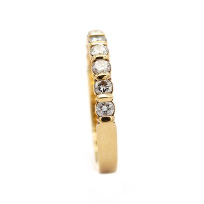 null Half wedding band in 18K (750) yellow gold set with modern cut diamonds. 

Weight...