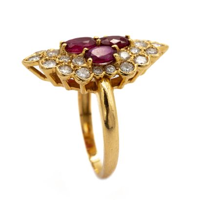 null Ring in 18 K (750) yellow gold stylizing a marquise with four rubies in clover,...