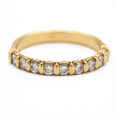 null Half wedding band in 18K (750) yellow gold set with modern cut diamonds. 

Weight...