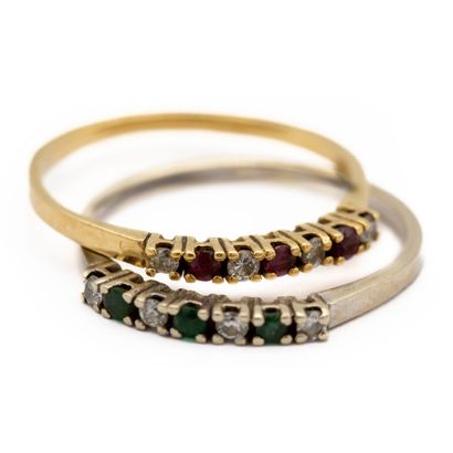 null Two 18K (750) gold garter rings, one in white gold set with emeralds and diamonds,...
