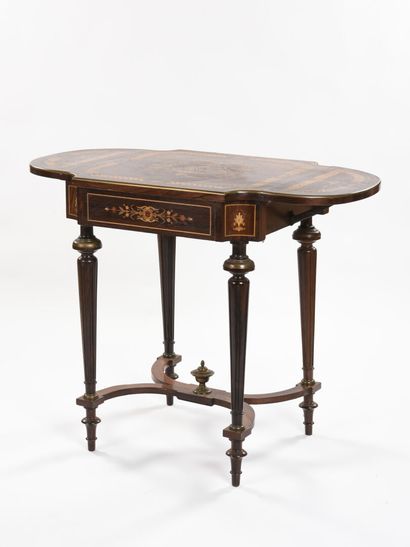 null A writing table with shutter in inlaid wood, tapered legs joined by an X-shaped...