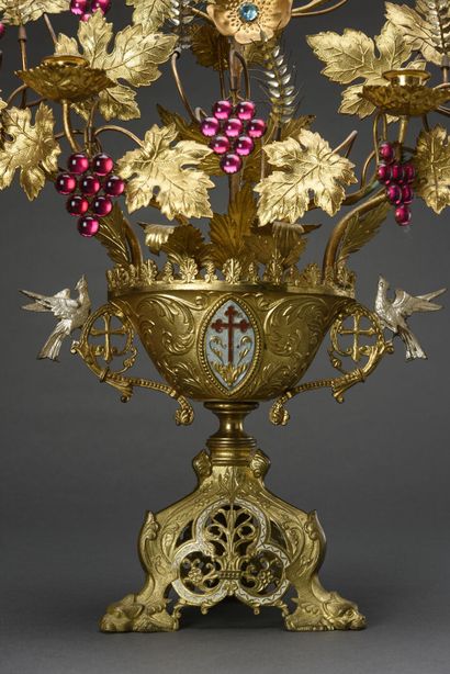 null Altar candelabra formed by a vase, centered by an enamelled shield, surmounted...