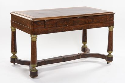 null Flat desk in mahogany veneer opening with a drawer in the belt, it rests on...