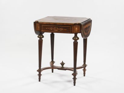 null A writing table with shutter in inlaid wood, tapered legs joined by an X-shaped...