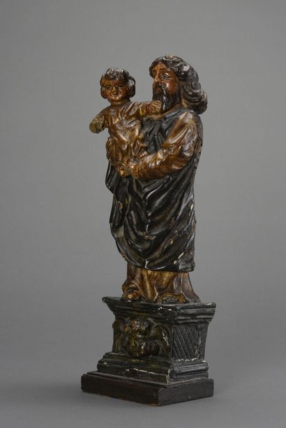 null Sujet en bois sculpté polychrome, Saint Joseph et l'Enfant Jésus 
18ème siècle.
H:43...