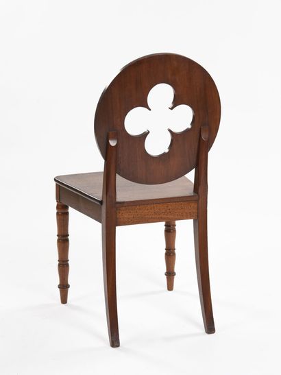 null Suite of four mahogany chairs, circular back cut with a four-lobed openwork,...