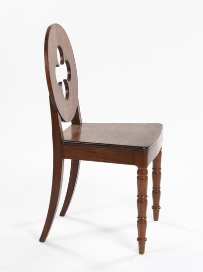 null Suite of four mahogany chairs, circular back cut with a four-lobed openwork,...