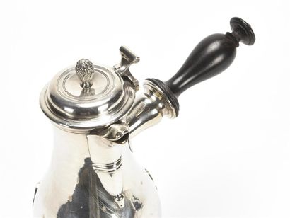null Baluster coffee pot with side handle in plain silver, it rests on three spatula-shaped...
