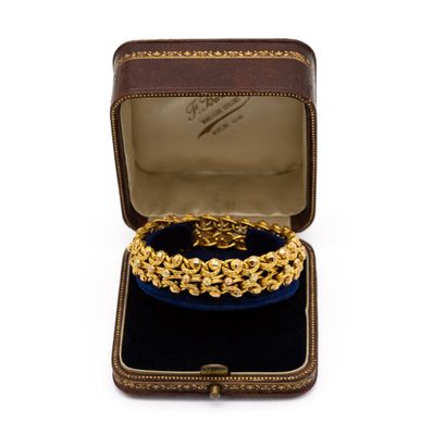 null Bracelet en or jaune, 18 K (750), maillons perlés et entrelacés. 
AIGLE 
Poids...