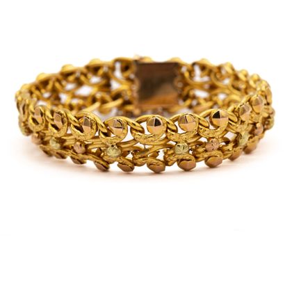 null Yellow gold bracelet, 18 K (750), beaded and interlaced links. 
AIGLE 
Weight...