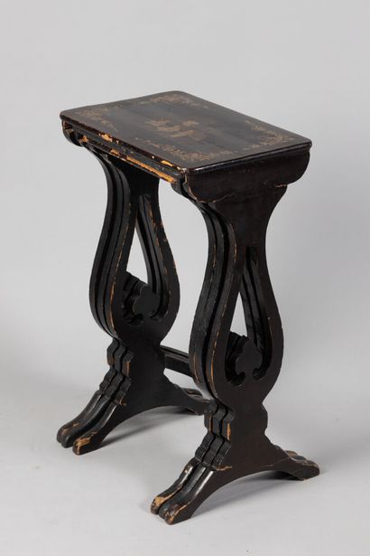 null Set of three nesting tables in blackened wood, top with orientalist decoration...