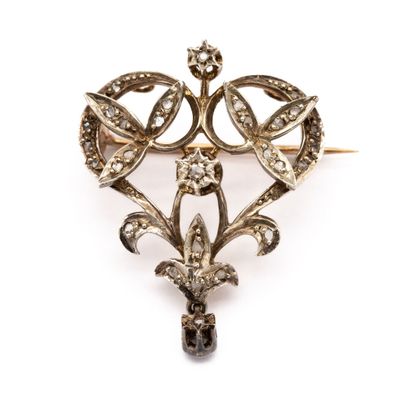 null Brooch and pendant in 18 K (750) yellow gold and silver, decorated with flowers...