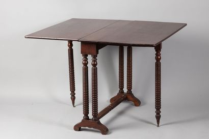 null Mahogany and mahogany veneer gate-leg table, turned wood ringed base joined...