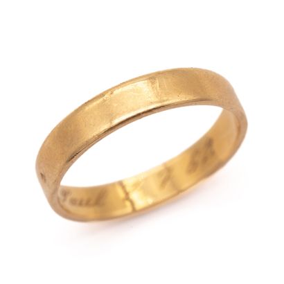 null Wedding ring in 18 K (750) yellow gold. 
AIGLE 
Weight 3,80 g. 
Numerated on...
