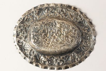 null Oval silver dish with repoussé decoration of a mythological scene (River Naiad)...