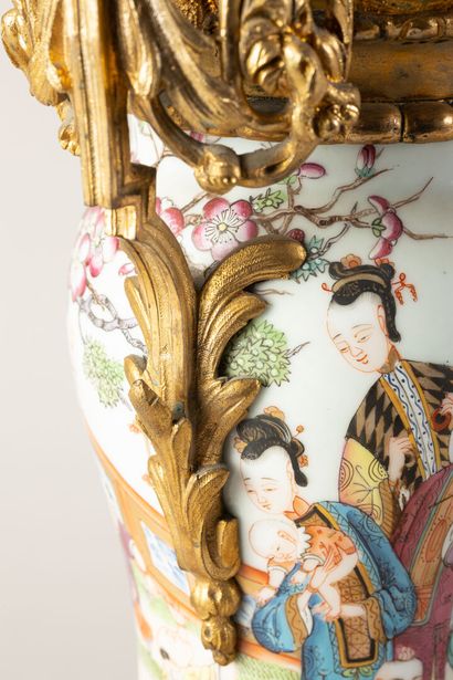 null A pair of Bayeux porcelain baluster vases, in the Chinese style, gilt bronze...