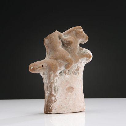 null Fragment of a statuette representing a rider on a prancing horse. He wears a...